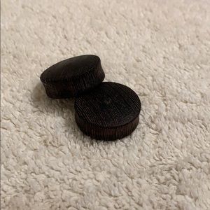 Dark wooden plugs
